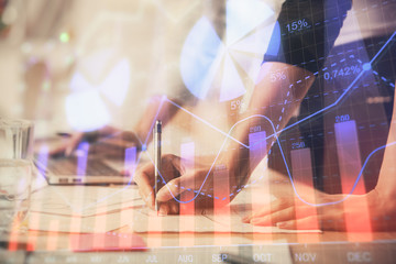 Multi exposure of woman hands typing on computer and financial chart hologram drawing. Stock market analysis concept.