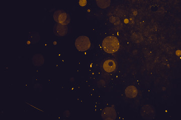 Dark Abstract Gold bokeh sparkle on black