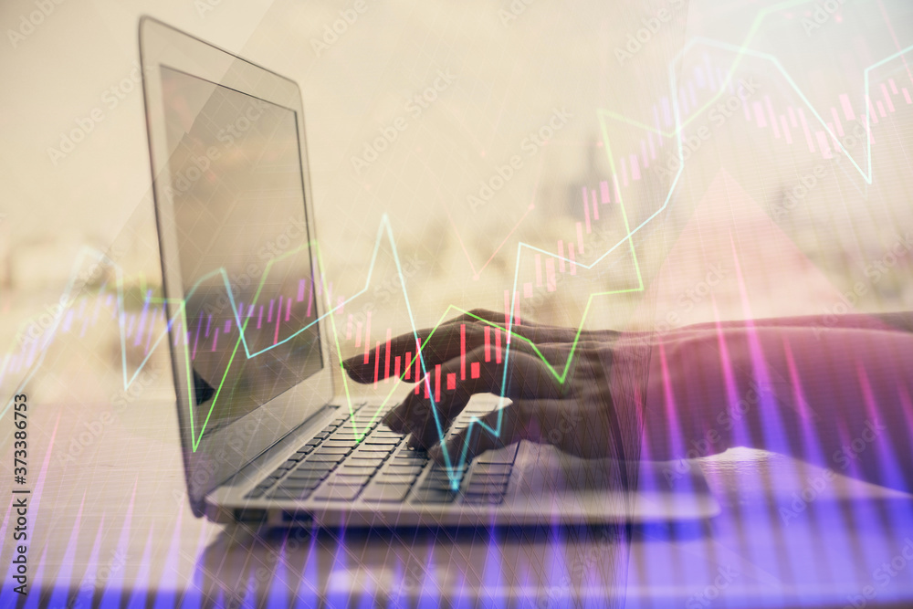 Wall mural double exposure of woman hands typing on computer and forex chart hologram drawing. stock market inv