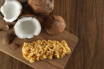 Cocada, coconut candy. Composition on wooden background