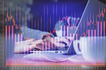 Double exposure of woman hands typing on computer and forex chart hologram drawing. Stock market invest concept.