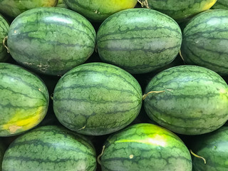 Arranging watermelons into piles