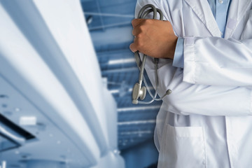 a doctor wears a white coat lab set and holding a stethoscope