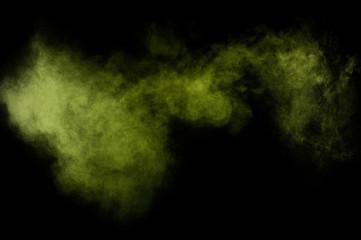 Obraz na płótnie Canvas Light green powder explosion on black background. Colored powder cloud. Colorful dust explode. Paint Holi.