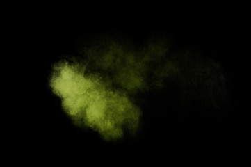 Light green powder explosion on black background. Colored powder cloud. Colorful dust explode. Paint  Holi.