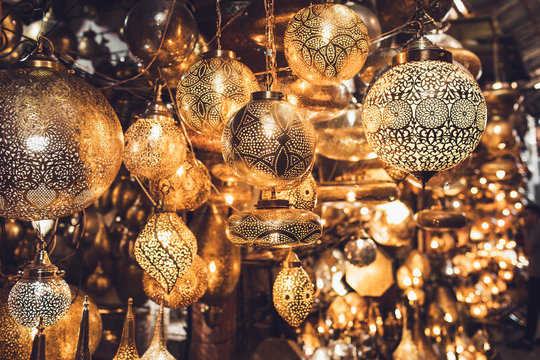 Traditional moroccan souvenir lamps on local market souk in Marrakesh medina. Handmade work, different shapes.