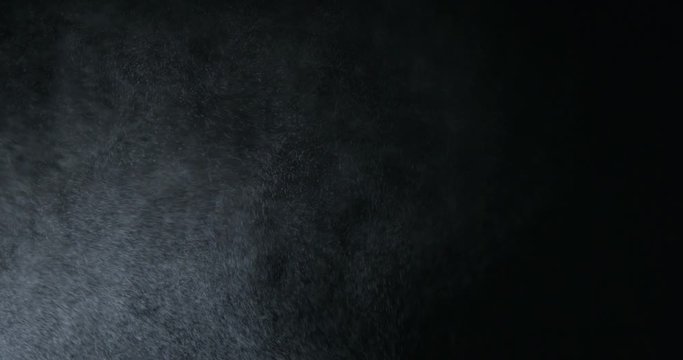 Water spray, microbes in air simulation, on black background
