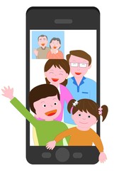 スマートフォンで孫たちとビデオ通話する高齢者