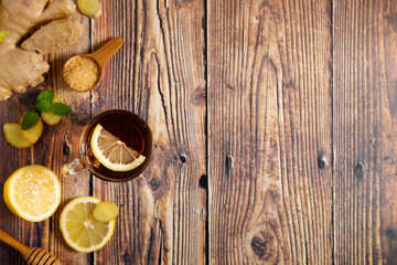 Lemon ginner tea with sliced fresh lemon and honey sugar