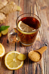 Lemon ginner tea with sliced fresh lemon and honey sugar