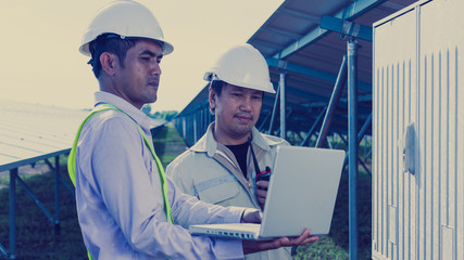 engineer or electrician working on  maintenance equipment at industry solar power