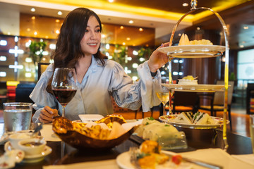 Young woman eating in the restaurant