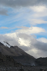 View of Mount Everest with the clouds and a bus from Everest Base Camp, Tibet