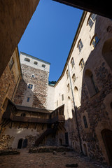 Fototapeta na wymiar Inner courtyard of the medieval and historical Turku Castle in Turku, Finland on a sunny day in the summer.