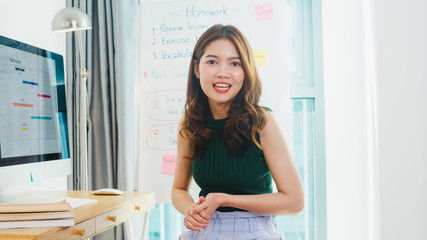 Asia young female english teacher video conference looking at camera talk by webcam learn teach in online chat at home. Remote education, Social distancing, quarantine for corona virus prevention.
