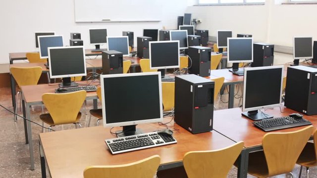 Empty modern multimedia classroom with computers