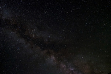 Milky way and many stars on night sky. Adventure travel. Milky way galaxy with stars on night sky.