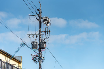Japanese electric pole with wire and transformer.