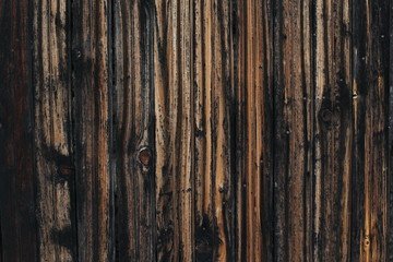 Rustic wooden planks background. An old wooden fence.