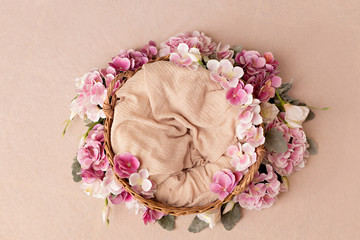 Wicker basket with summer pink hydrangea flowers. Copy space
