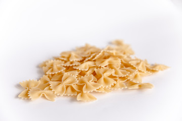 Pasta on a white background. bow. Variety of types and shapes of Italian pasta.