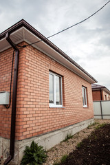 Brick house Wall Facade. construction of houses. cottage red brick house