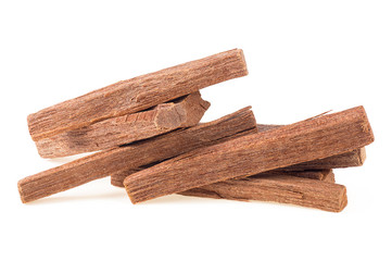 Close up of sandalwood sticks isolated on a white background