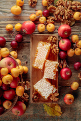 Honey, walnuts and small apples, healthy organic food.