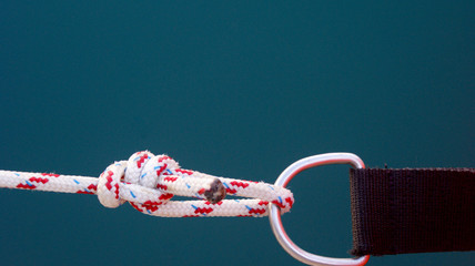 a strong rope with a strong marine knot holyard hitch tied to a metal ring