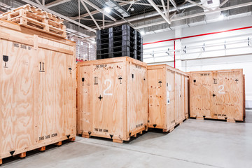 Wooden boxes in the warehouse. Boxes out of wood for packing industrial machinery. Warehousing....