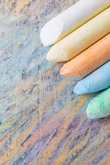 Chalks with colorful painted background
