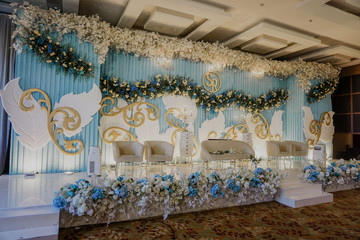 luxury wedding stage decoration background. white and blue theme concept. hanging flower