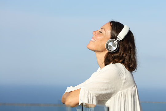 Adult woman breathing relaxing listening to music