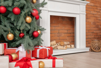 Interior of modern room with fireplace on Christmas eve
