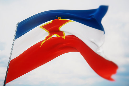 Waving flags of the world - flag of Yugoslavia. Shot with a shallow depth of field, selective focus. 3D illustration.