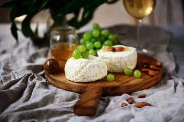 Farmer camembert cheese on the cutting board. selective focus