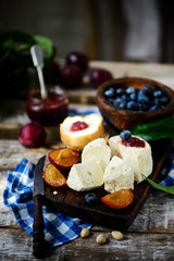 Farmer camembert cheese on the cutting board. selective focus