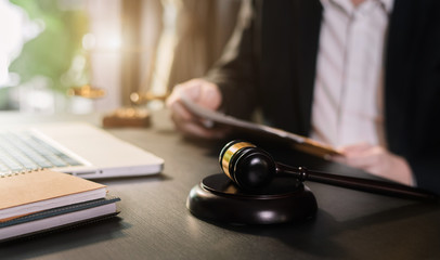 Lawyers discussing contract papers sitting in the table at office in the morning. concepts of law, advice, legal services.