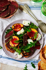 Grilled peaches, goat cheese, and bresaola salad..
