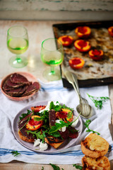 Grilled peaches, goat cheese, and bresaola salad..