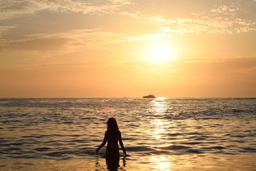 silhouette of a woman on a sunset