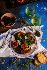 Grilled peaches, goat cheese, and bresaola salad..