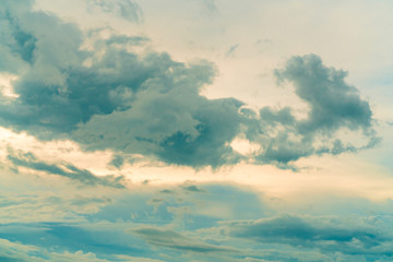 Blue sky and white clouds in the morning with sunrise light. Beautiful cloudscape in the morning. Happy day. Heaven sky with golden sunlight. Beauty in nature. Peaceful and tranquil background.
