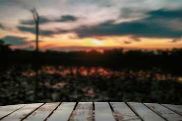 Fototapeta na wymiar sunset over the old wooden bridge