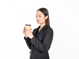 Young Asian smiling businesswoman in suit drinking coffee isolated on white background.