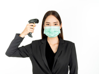 Asian woman wearing green medical mask holding infrared thermometer or digital Thermometer gun isolated on white background.