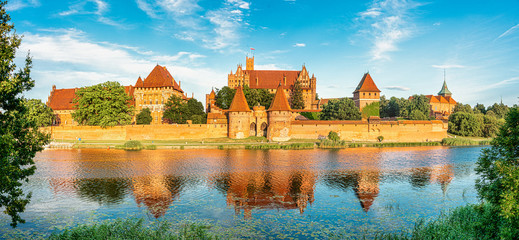 Naklejka na ściany i meble The Castle of the Teutonic Knights Order in Malbork, Poland, historical Prussia, is the largest castle in the world