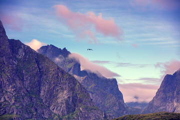 Silhouette of mountains against a sunset sky. Rocks in the evening