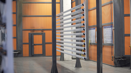 Industrial painting units. Industrial painting of parts from spray guns. Painting parts in workshop of enterprise without human participation. Powder coat spray gun for industrial spray painting