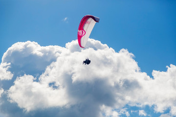 Paragliding in the sky on a sunny day.